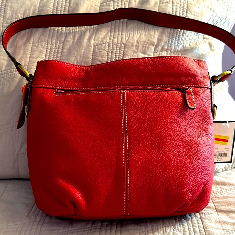 Red leather purse,tags still on . Never been used !